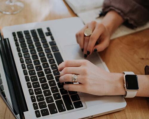 woman typing on laptop